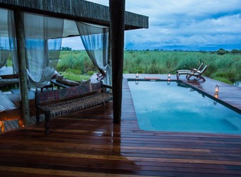 Selinda Camp, an exquisite en suite bathroom with a massive wash tub centered in the middle of the walk in bathroom with two separate rooms in Africa