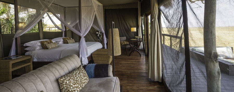 Shumba Camp Kafue National Park Zambia tented luxury room with four poster bed and mosquito netting