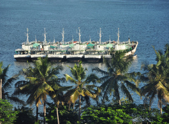 A row of several boats in the very important harbor of the vital city of Dar es Salaam, Tanzania